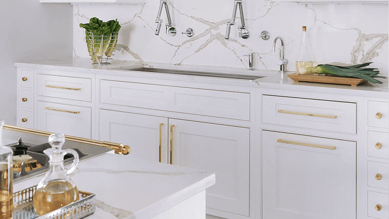 white cabinets with gold knobs and handles